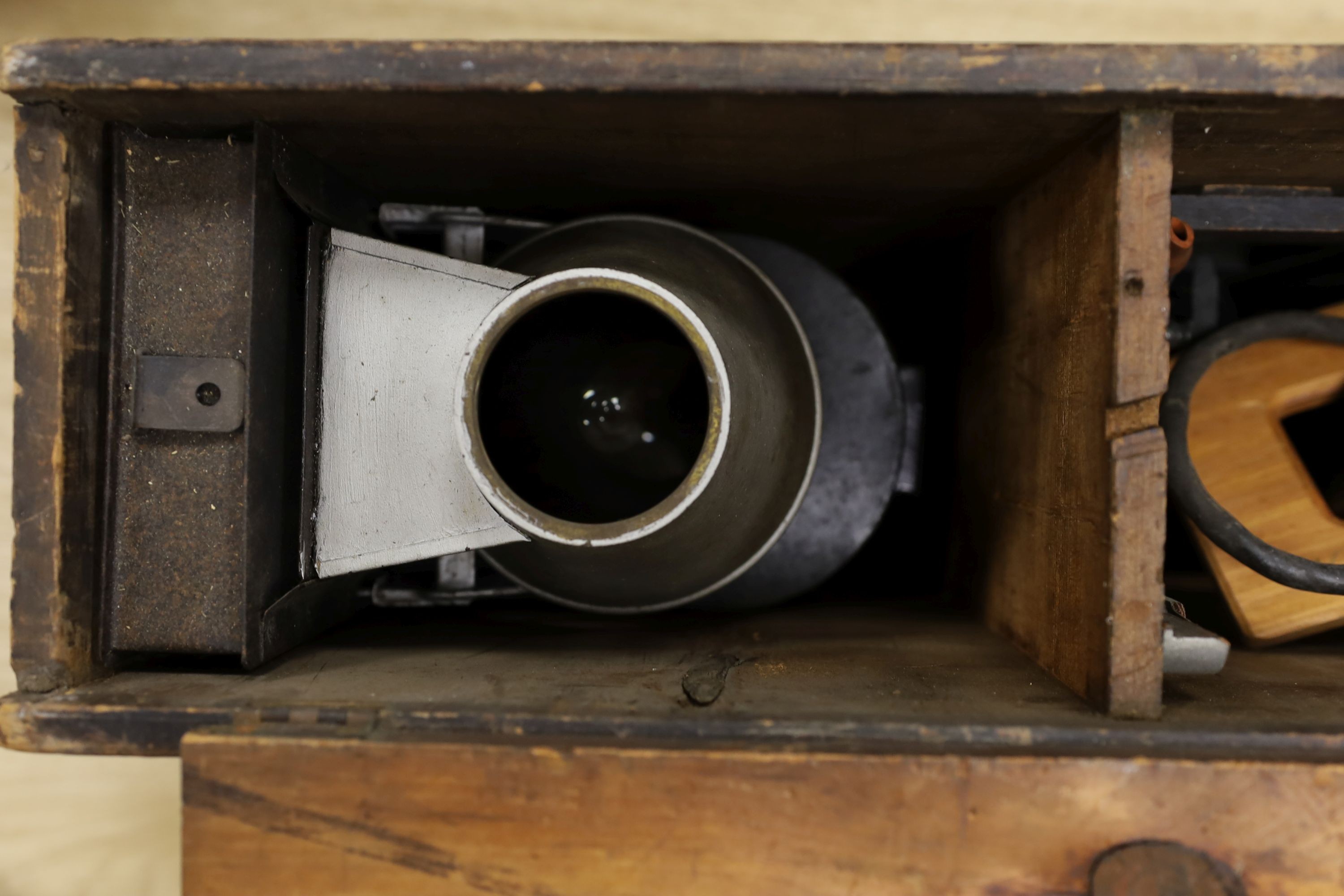 A late 19th century Magic lantern, cased with slides